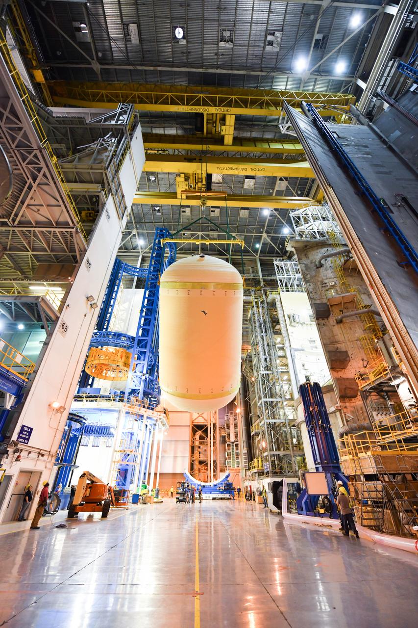 The Space Launch System (SLS) rocket’s liquid oxygen tank structural test article was manufactured and stacked in June 2019 at NASA’s Michoud Assembly Facility in New Orleans. To construct the test article, Boeing technicians at Michoud moved the liquid oxygen tank to the Vertical Assemby Building stacking and integration area. Here, they added simulators to mimic the two structures that connect to the tank, the intertank and the forward skirt.  This structural hardware for the SLS core stage for America’s new deep space rocket is structurally identical to the flight version of the tank. It will be shipped on the Pegasus barge to NASA’s Marshall Space Flight Center in Hunstville, Alabama, where it will undergo a series of tests that simulate the stresses and loads of liftoff and flight. These tests will help ensure designs are adequate for successful SLS missions to the Moon and beyond. The flight liquid oxygen tank along with the liquid hydrogen tank supplies more than 500,000 gallons of propellant to the core stages four RS-25 engines, which produce 2 million pounds of thrust to help send the SLS rocket to space.